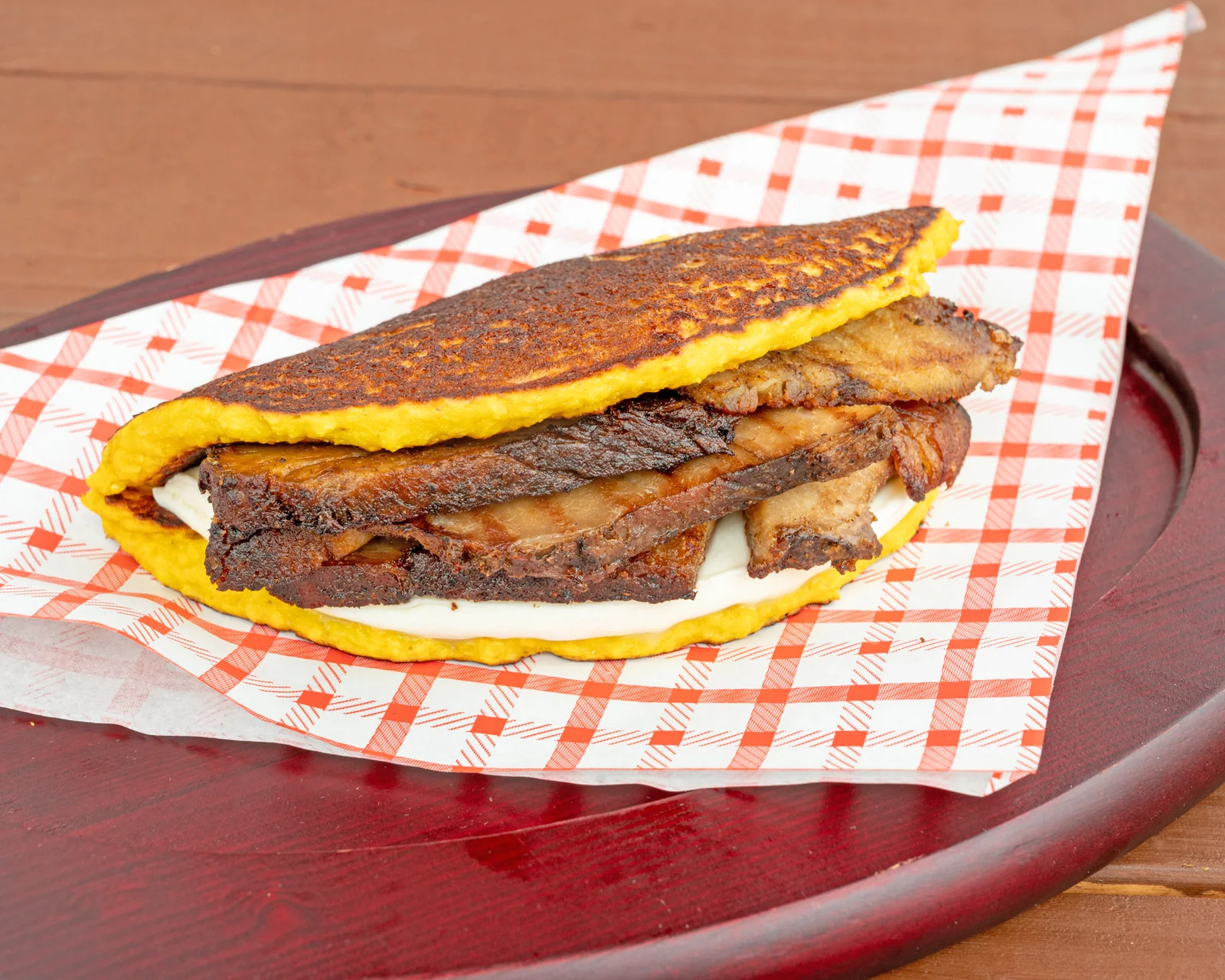 Cachapa with pernil and cheese